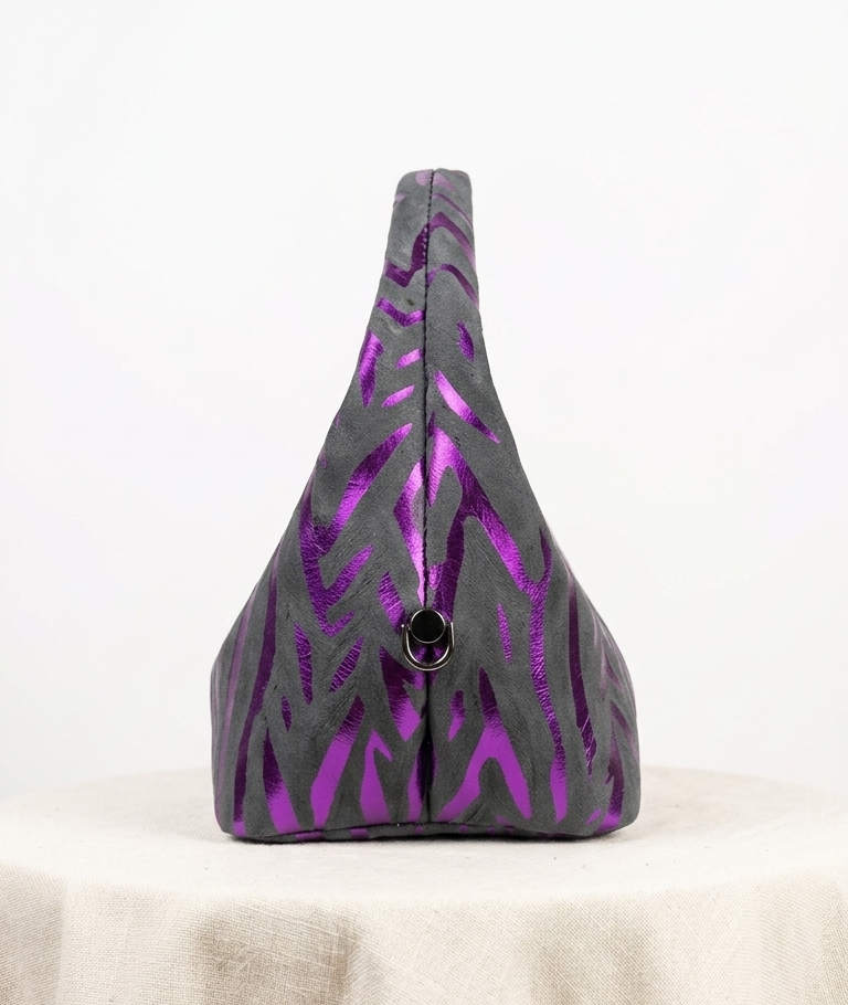 Nelo MIDI, embossed in purple and black ( second image , side view )